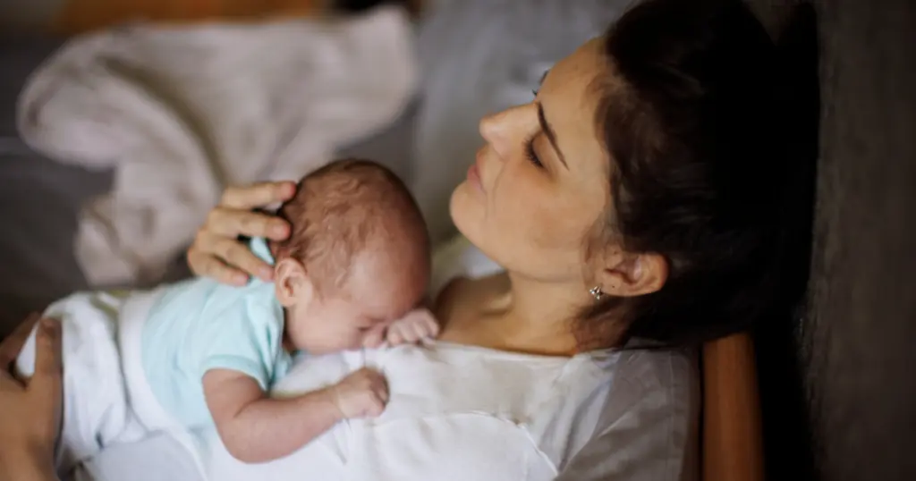Postpartum Red Flags, Mom with newborn baby on her chest