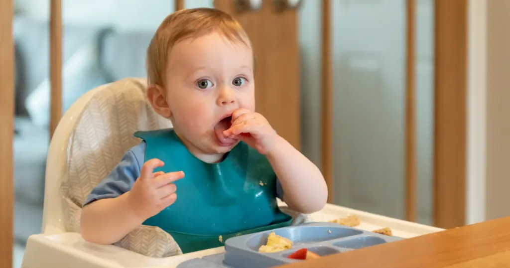 Baby Eating in his highchair, Tips for Weaning from Breastfeeding