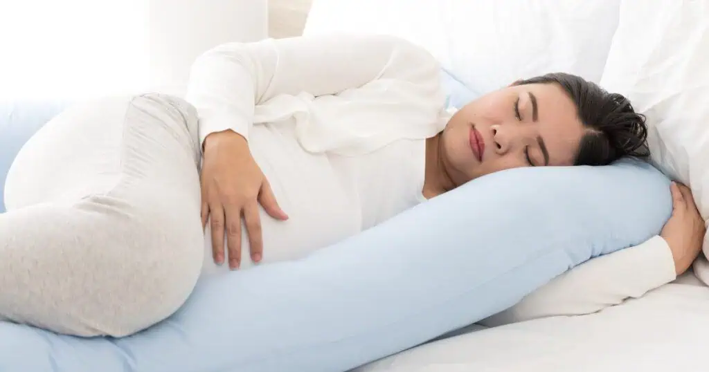 Pregnant Mom lying in bed, PCOS and Pregnancy