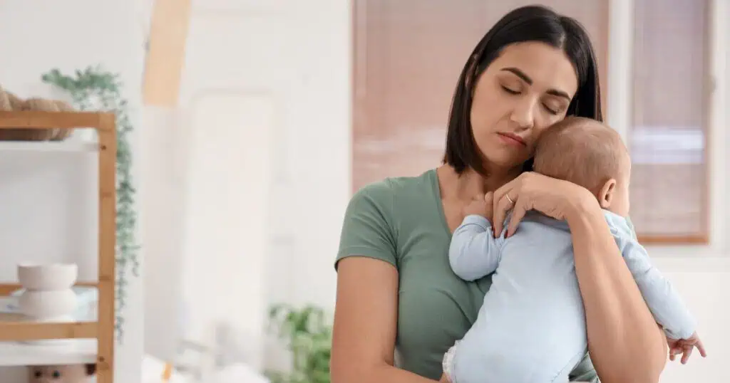 Postpartum Recovery, New Mom Holding her baby