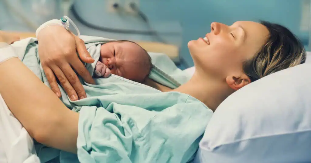 Mom holding newborn baby that she just gave birth to - Can I have A VBAC